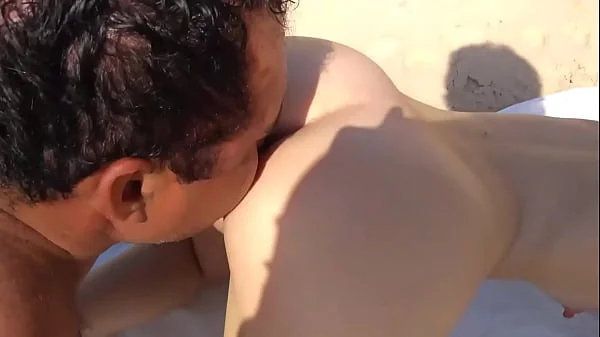 Naughty wife teasing on the nudist beach and enjoys in the mouth of the bastard