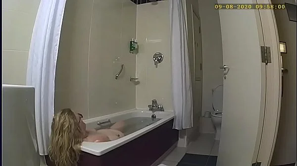 Wife caught on spycam playing with herself in hotel bathroom