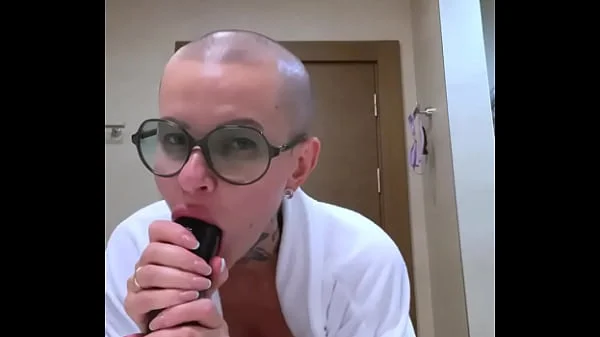 Blowjob dildo from a bald girl with big tits